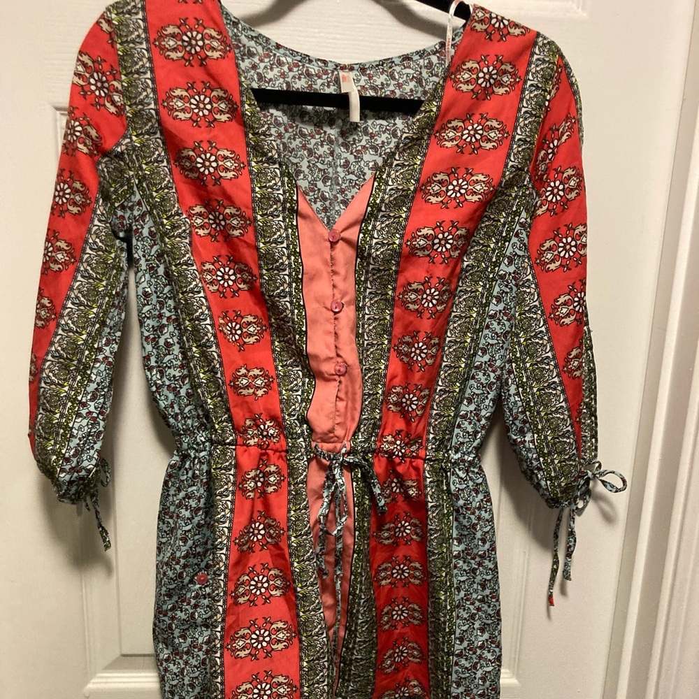 True Destiny blouse with slit open sleeves.